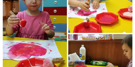 Powiększ grafikę: Marysia, Kamila i żywia przygotowują laurki dla dziadków - pomponem stemplują serca z papieru