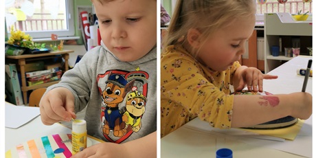 Powiększ grafikę: Szymon i Amelka wykonują pracę plastyczną - wielkanocne kolorowe jajko w paski zdobione wybranymi naklejkami